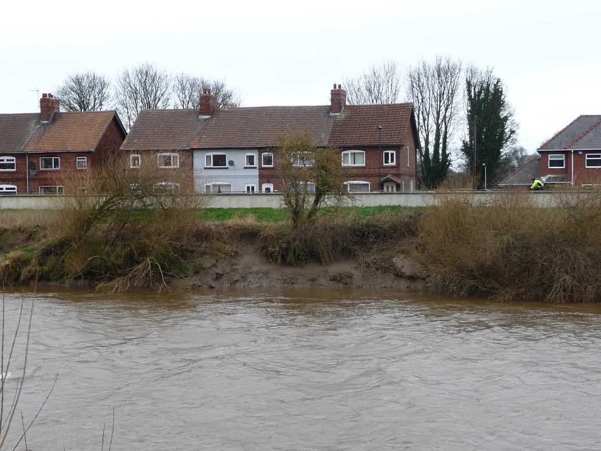 Brick houses behind the flood wall on the bank of the River Ouse in Selby